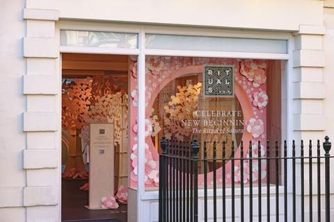 Exterior of Rituals pop-up, Covent Garden. Text in window says 'Celebrate new beginnings: The Ritual of Sakura'